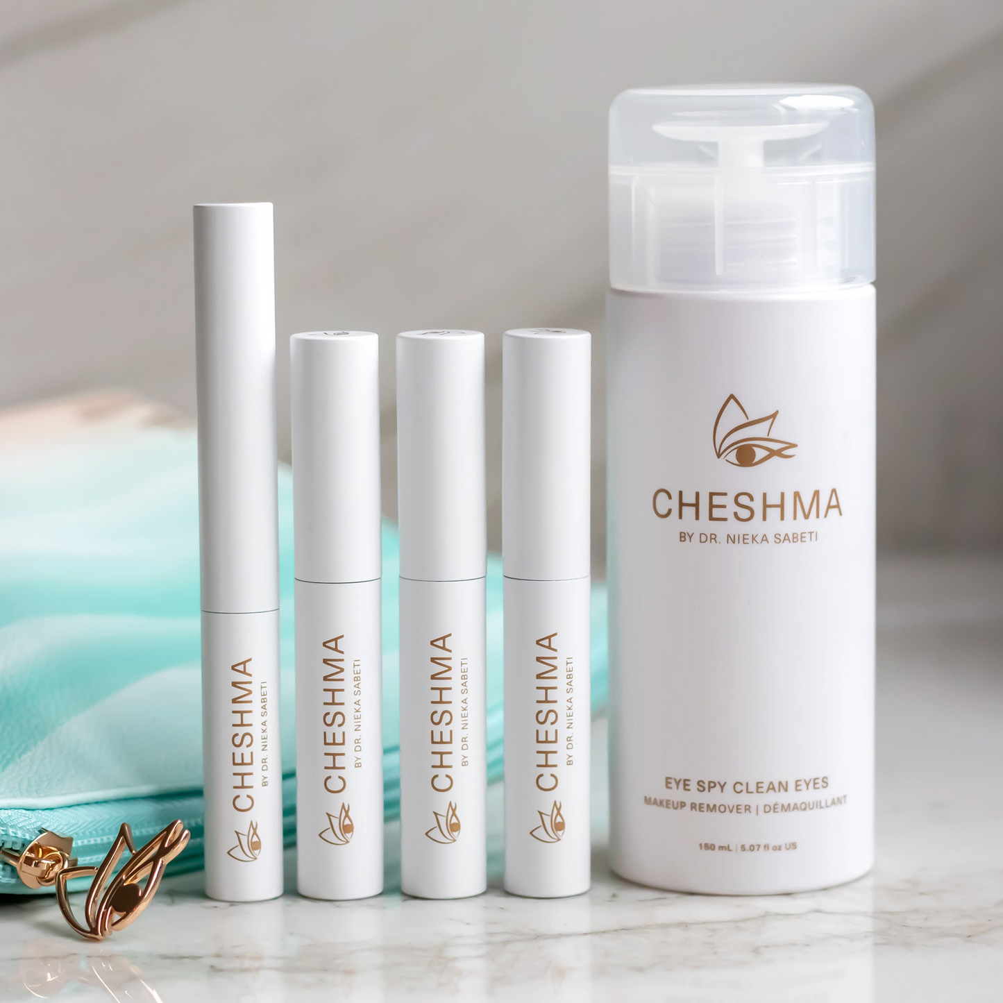 cheshma vials on marble counter and blue bag