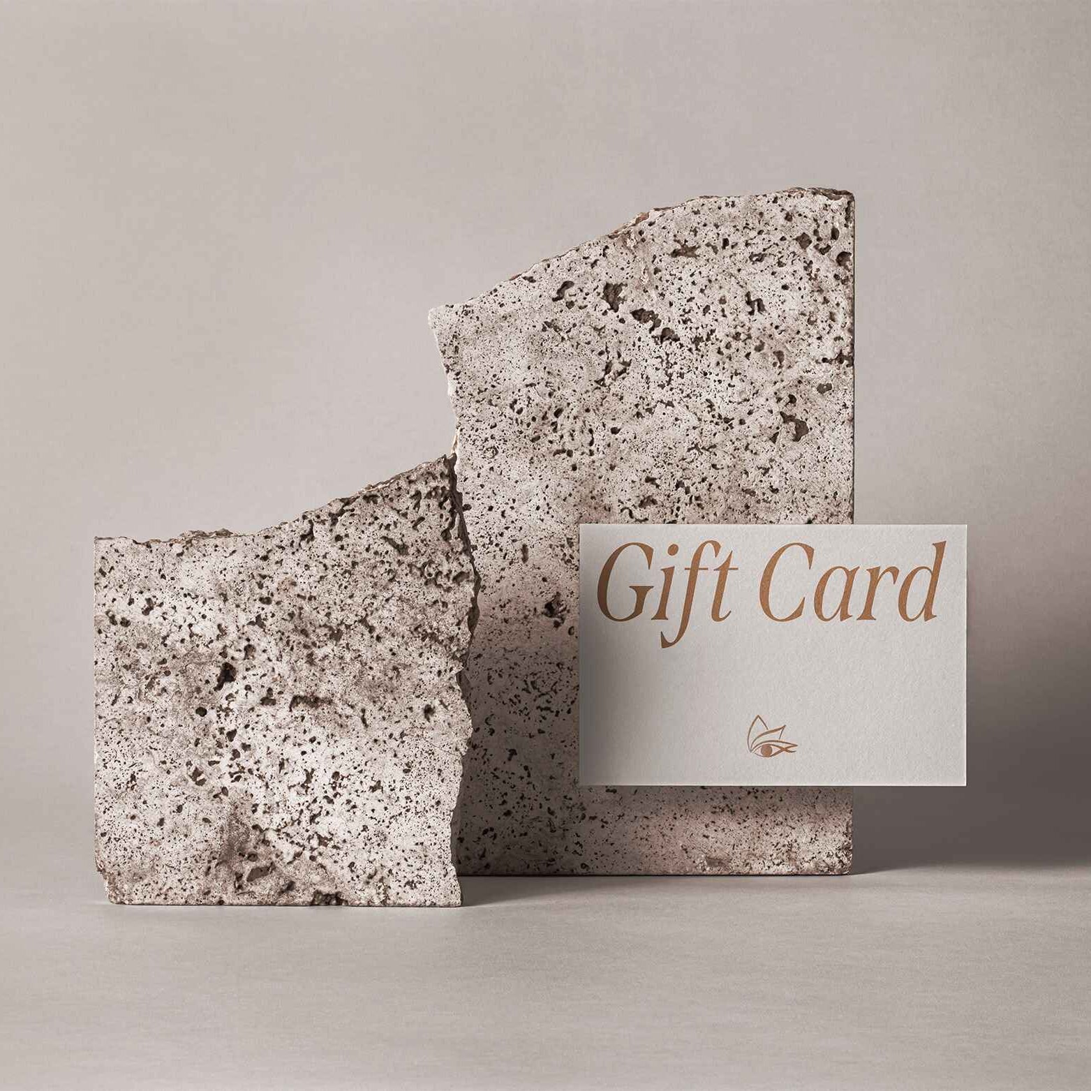 Two textured gift cards with a 'Gift Card' label on a neutral background