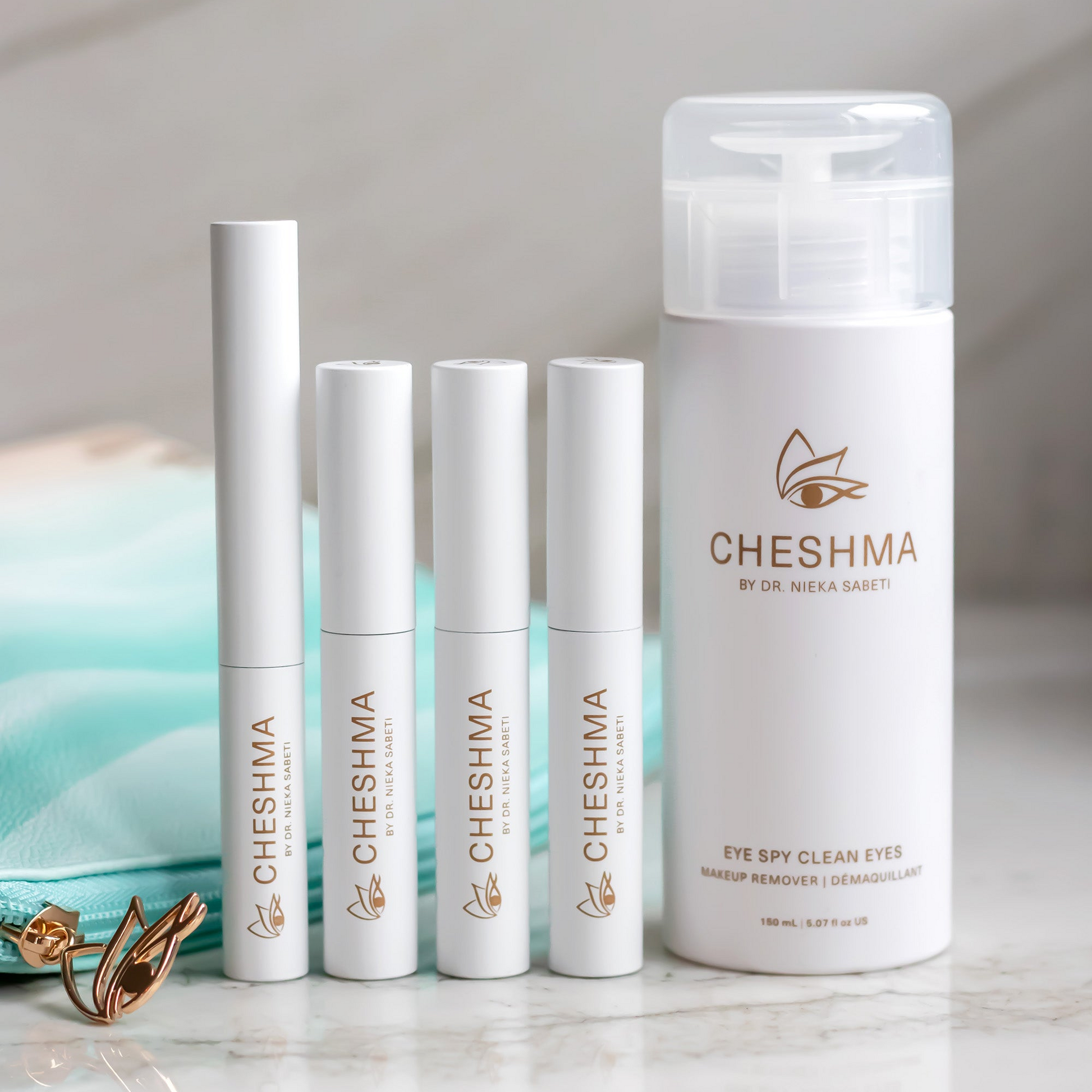 cheshma vials on marble counter and blue bag